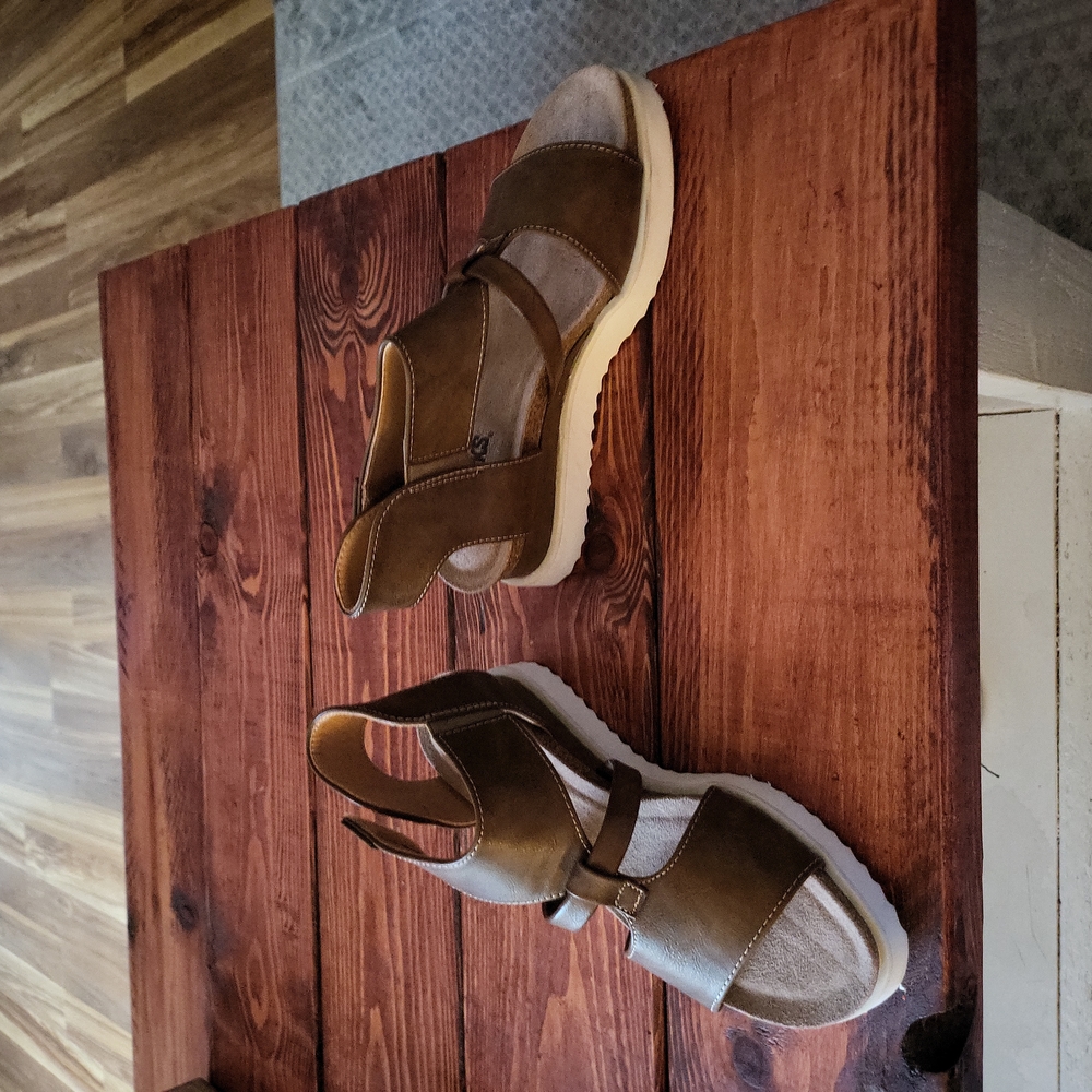 Brown, velcro closure, white sole.